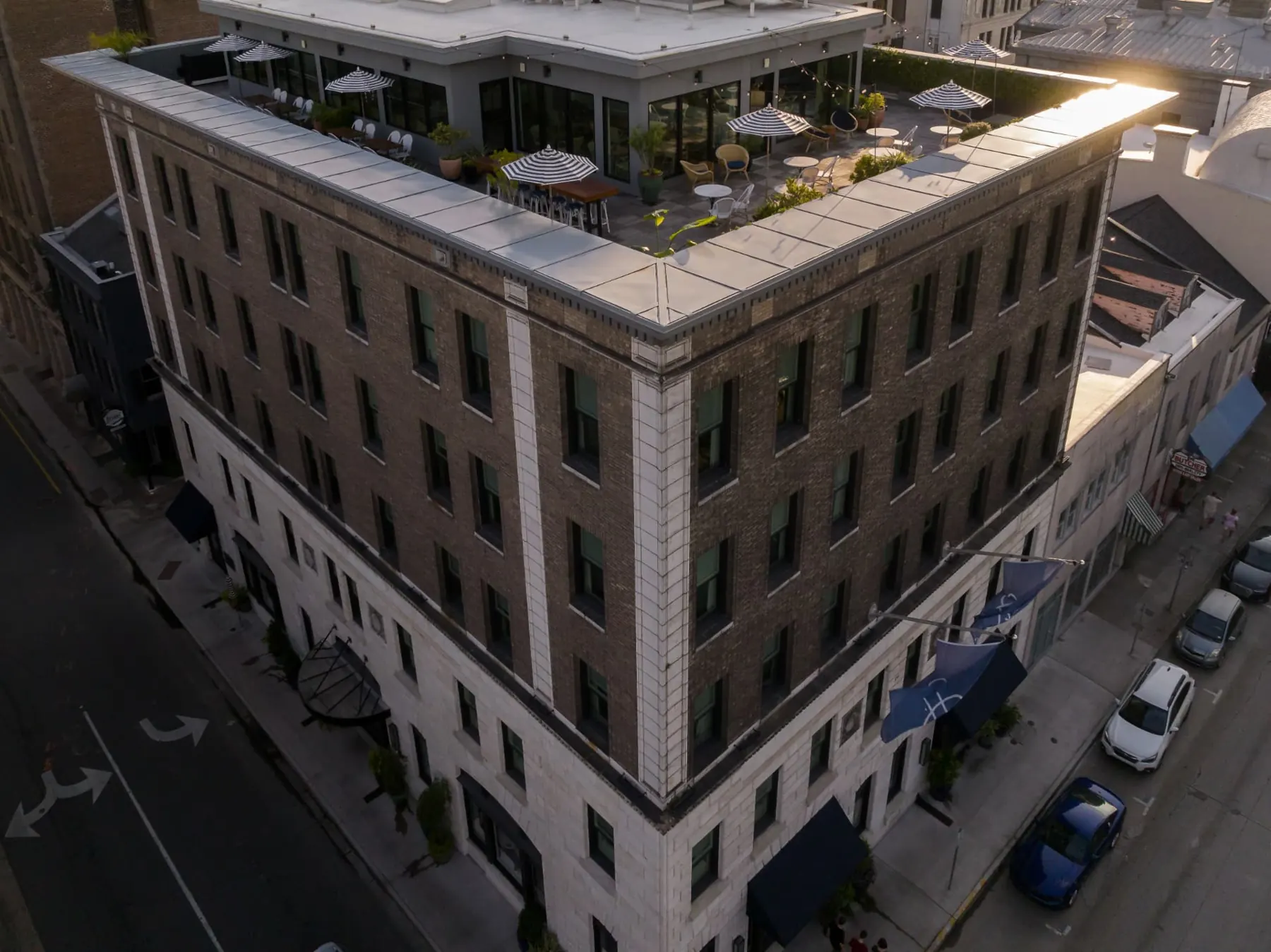 Aerial view of The Drayton Hotel and its rooftop terrace in Savannah's Historic District